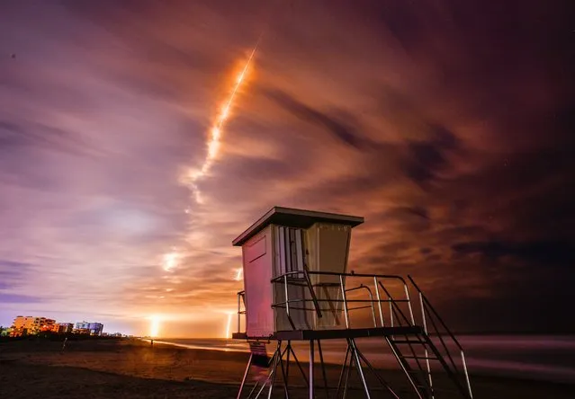 SpaceX and NASA Launch of the PACE spacecraft atop a Falcon 9 rocket from Launch Complex 40 at Cape Canaveral Space Force Station in Brevard County, Florida on February 8, 2024. Photo shows launch and booster landing back at CCSFS about 7 minutes 30 seconds after launch. In the foreground is one the new modular lifeguard stands at Minuteman Causeway, replacing the old wooden tower. (Photo by Malcolm Denemark/Florida Today via USA Today Network)