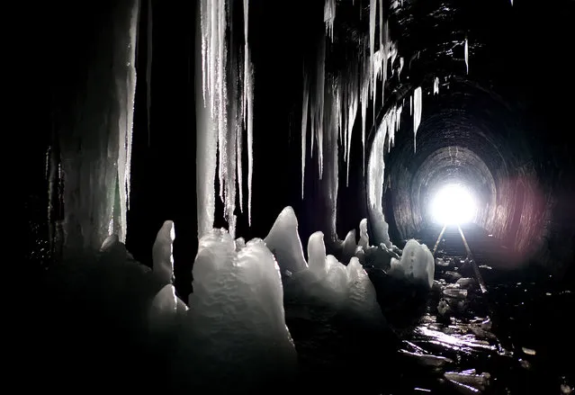 A view of icicles in the narrow-gauge railway tunnel in Szklary, south-eastern Poland, 13 February 2017. The 602 meters long tunnel resembles an ice cave with stalactites and stalagmites. (Photo by Darek Delmanowicz/EPA)