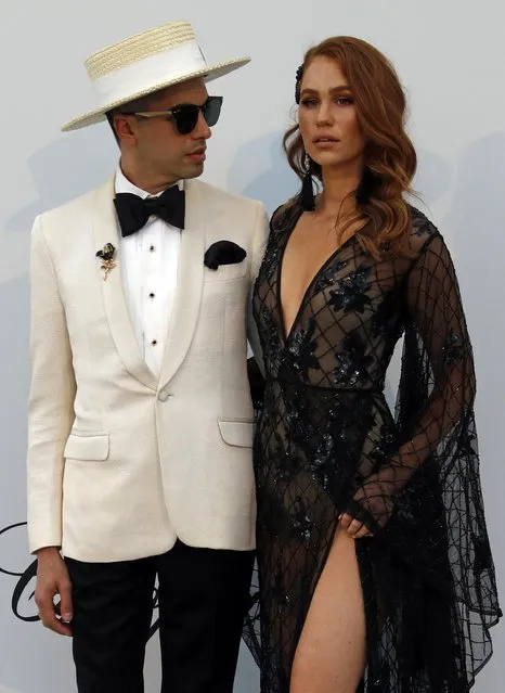 DJ Cassidy poses with Kelsey Evenson for photographers upon arrival at the amfAR, Cinema Against AIDS, benefit at the Hotel du Cap-Eden-Roc, during the 72nd international Cannes film festival, in Cap d'Antibes, southern France, Thursday, May 23, 2019. (Photo by Eric Gaillard/Reuters)