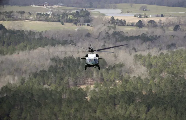 Marine One, with President Donald Trump onboard, flies near damaged areas while enroute to Auburn, Ala., Friday, March 8, 2019. (Photo by Carolyn Kaster/AP Photo)
