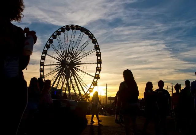 The sun sets behind a Ferris Wheel during the final day of the Rock in Rio USA concert in Las Vegas, Nevada May 16, 2015. (Photo by L. E. Baskow/Reuters)