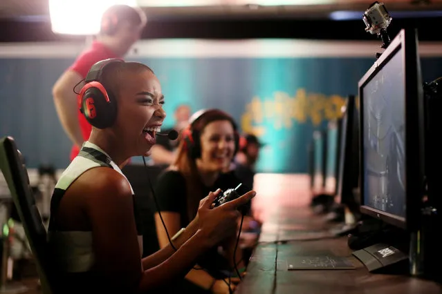 Alexandra Shipp plays Tom Clancy's Rainbow Six Siege during Ubisoft event at Comic-Con 2015 in San Diego on Saturday, July11, 2015. (Photo by Sandy Huffaker/Invision for Ubisoft/AP Images)