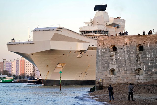 The Royal Navy aircraft carrier HMS Prince of Wales passes the Round Tower in Portsmouth Harbour, as it sets sail for exercises on Wednesday, January 12, 2022. For the next year will serve as the Nato command ship, after the Royal Navy took charge of Nato's fast reaction maritime task force formed to tackle major incidents around the world. (Photo by Andrew Matthews/PA Images via Getty Images)