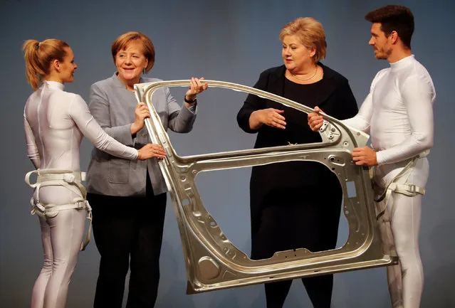 German Chancellor Angela Merkel and Norwegian Prime Minister Erna Solberg are seen during the official opening of a production line for the car industry at a branch of Norway's Hydro aluminum company in Grevenbroich, Germany May 4, 2017. (Photo by Wolfgang Rattay/Reuters)