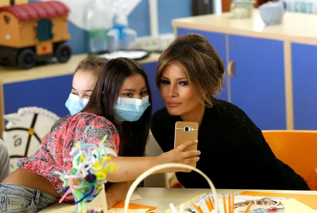 A girl takes a selfie with U.S. first lady Melania Trump at the Bambino Gesu hospital in Rome, Italy, May 24, 2017. (Photo by Remo Casilli/Reuters)