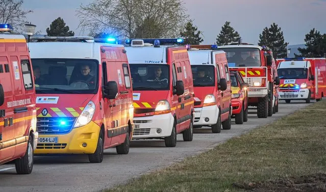 A convoy of firefighting vehicles and relief equipment, donated by France to Ukraine,  arrive at the humanitarian hub of Suceava in Romania, close to the Ukrainian-Romanian border, April 18, 2022. After a 2,500 km journey through five countries, a convoy of 40 vehicles loaded with 50 tonnes of relief equipment arrived at the border between Romania and Ukraine where this equipment will be handed over to Ukrainian rescuers. One hundred firefighters  transported 12 fire vehicles and 12 personal rescue vehicles. Nearly 50 tonnes of equipment, including tools for locating victims in the rubble, lifting cushions or equipment for fighting fuel fires, will be handed over to Ukrainian civil security.  This is the second convoy, after that which left in March, from Civil Security in coordination with the crisis management center of the Ministry of the Interior (CDCS), in conjunction with their European and Ukrainian counterparts. “The equipment will make possible to replenish the stocks of the Ukrainian civil security services in the regions bombed by the Russians”, CDCS deputy director Alexis Le Cour Grandmaison told AFP. A total of “29 Ukrainian firefighters died in the fire, dozens of barracks (were) completely or partially destroyed as well as 300 vehicles destroyed or damaged by the Russian army”, he said. (Photo by Daniel Mihailescu/AFP Photo)