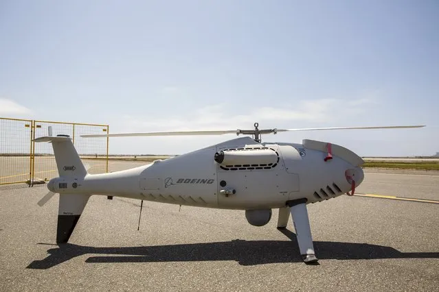Boeing Co. & Schiebel Industries' S-100 Camcopter stands on the runway during “Black Dart”, a live-fly, live fire demonstration of 55 unmanned aerial vehicles, or drones, at Naval Base Ventura County Sea Range, Point Mugu, near Oxnard, California July 31, 2015. (Photo by Patrick T. Fallon/Reuters)