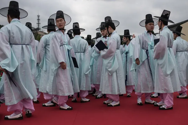 South Korean students attend a traditional coming-of-age ceremony at Namsan hanok village in Seoul on May 15, 2017. (Photo by Ed Jones/AFP Photo)