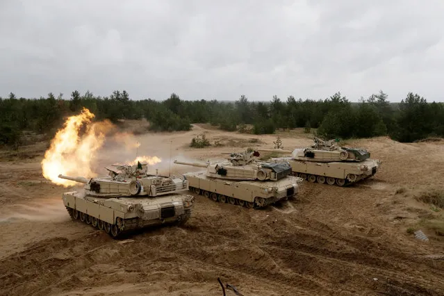 U.S. M1 Abrams tanks fire during the “Saber Strike” NATO military exercise in Adazi, Latvia, June 11, 2016. (Photo by Ints Kalnins/Reuters)