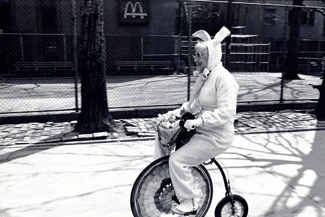 Easter Bunny. “This was taken in the 1970s, when I was in love with New York. The place was full of soul back then: there was life on the streets, eccentric characters on every corner, millions of people with colourful stories to tell. I mean it’s not every day you go out and see an Easter bunny on a tricycle, is it? People came to New York to be New Yorkers, not just because they got a job in the city. It was so alive. I would hang my camera around my neck and hit the streets, knowing that some quirky character would soon come my way. And there I was walking through Greenwich Village when this charming elderly lady rode past, full of smiles. She was happy that I noticed her. I remember thinking what lovely spirit she had. There is an innocence about her that I still adore – an older woman with a sense of fun, enjoying her life and making everyone around her happy. Nowadays, when I look at this photo, I just see a New York that has lost its heart and soul. The city has became all about real estate and money. It used to be about neighbourhoods, each one like a small town, with its own flavour and personality. Greenwich Village was the bohemian area, with bars open late and jazz. I’m heartbroken to think it’s gone”... (Photo by Jill Freedman/Steven Kasher Gallery)