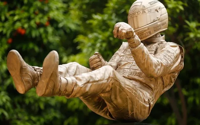 A bronze sculpture by British artist Paul Oz depicting late Brazilian Formula One driver Ayrton Senna is unveiled during a ceremony in Barcelona on May 8, 2019 to mark the 25th anniversary of his death. The Brazilian icon died after a crash at the San Marino GP at the Imola circuit on May 1, 1994 at the age of just 34. (Photo by Pau Barrena/AFP Photo)