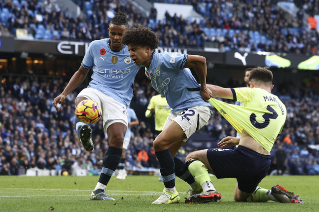 Southampton's Ryan Manning, right, duels for the ball with Manchester City's Rico Lewis, center, and Manchester City's Manuel Akanji during the English Premier League soccer match between Manchester City and Southampton at the Etihad Stadium in Manchester, England, Saturday, October 26, 2024. (Photo by Darren Staples/AP Photo)