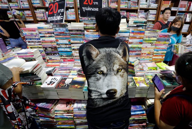 Visitors check for books during the Book Expo Thailand 2024 in Bangkok, Thailand, 10 October 2024. The Book Expo Thailand 2024 held between 10 to 20 October 2024 with more than two million books from 286 publishing houses present their premium quality of both local and international books for book lovers along with many activities to attract new readers. For the book fair is expected to attract 1.6 million people and will generate about 460 - 480 million Thai baht, (about 13.7 - 14.3 million US dollars or 12.5 - 13 million euro), according to the president of The Publishers and Booksellers Association of Thailand. (Photo by Narong Sangnak/EPA/EFE)