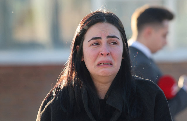A woman reacts at the entrance of the headquarters of Turkey's aviation company TUSAS, where three people were killed and five others wounded in an attack, near Kahramankazan, a town of Turkish capital Ankara, on October 23, 2024. (Photo by Reuters/Stringer)