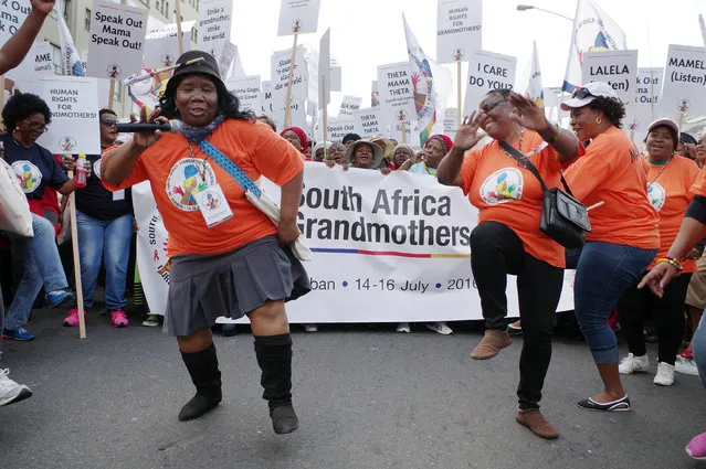 Several hundred protesting grandmothers gather in Durban, South Africa, Saturday July 16, 2016, and march to the International Conference Center, to demand more government support as caregivers for children orphaned by the AIDS epidemic. On Monday, the return of hundreds of AIDS researchers and activists to Durban will highlight how radically the country's outlook has changed. South Africa now is a global proving ground for treatment and prevention, including a study of an experimental HIV vaccine set to begin later this year. (Photo by AP Photo)