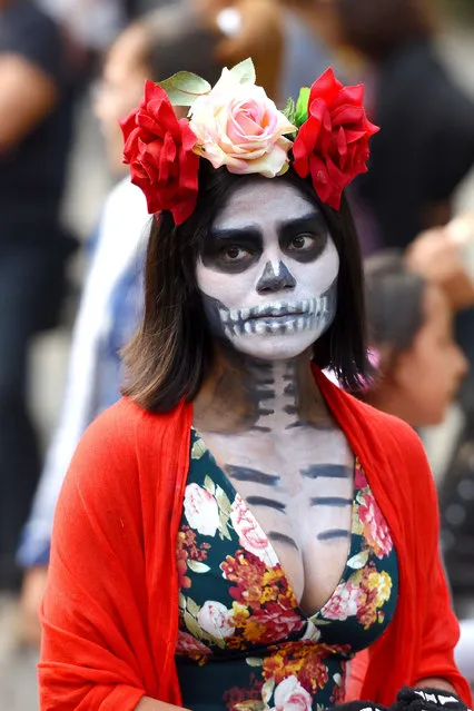 Participants are seen during the traditional Day of the Dead parade at Reforma Avenue in Mexico City, Mexico on October 28,  2017. (Photo by Carlos Tischler/Rex Features/Shutterstock)