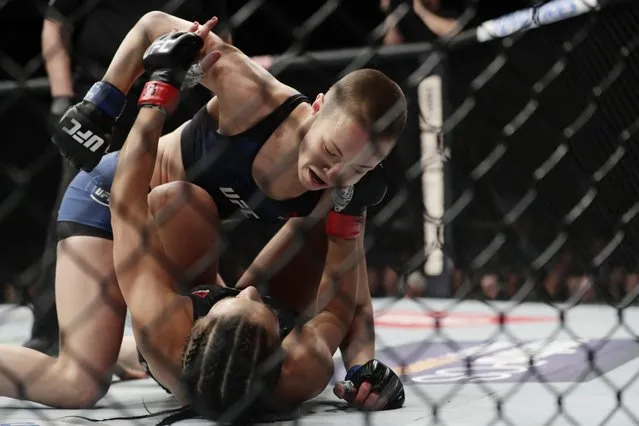 Rose Namajunas, above, punches Joanna Jedrzejczyk, of Poland, during a women's strawweight title mixed martial arts bout at UFC 217 on Saturday, November 4, 2017, in New York. Namajunas won the fight. (Photo by Frank Franklin II/AP Photo)