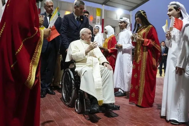 Pope Francis arrives for a meeting with the youth at the Sacred Heart School in Manama, Bahrain, Saturday, November 5, 2022. Pope Francis is making the November 3-6 visit to participate in a government-sponsored conference on East-West dialogue and to minister to Bahrain's tiny Catholic community, part of his effort to pursue dialogue with the Muslim world. (Photo by Alessandra Tarantino/AP Photo)