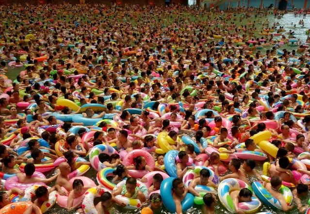 People cool off at a swimming pool in Daying county, Sichuan Province, China, August 14, 2016. (Photo by Reuters/China Daily)