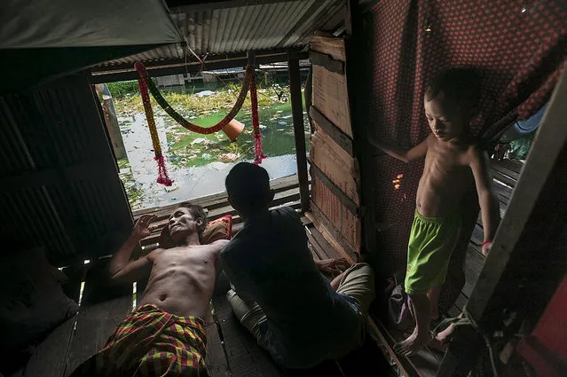 Phay Phanna, 60, lost his leg when he stepped on a land mine in 1988 near the Cambodian-Thai border. He is a widower and is the sole head of his family, caring for 11 children in a home he does not own. It has been scheduled for demolition since being purchased by a private developer in 2008 in Phnom Penh, Cambodia. (Photo by Renée C. Byer)