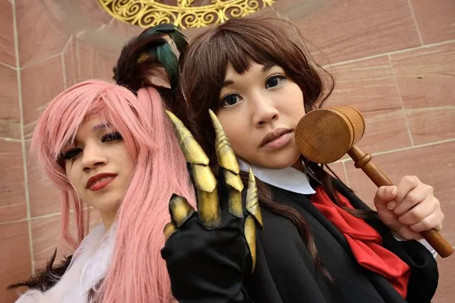 Two cosplayer pose at the “Frankfurter Buchmesse” on October 12, 2014 in Frankfurt am Main, Germany. Cosplay is a contraction of the words “costume” and “play” together. Cosplayer live their hobby with animated films, comics and mangas and role playing. (Photo by Thomas Lohnes/Getty Images)