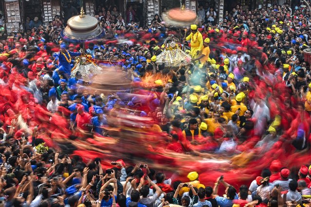 Hindu devotees take part in the “Pahchare Chariot festival” in Kathmandu on March 30, 2025. (Photo by Prakash Mathema/AFP Photo)