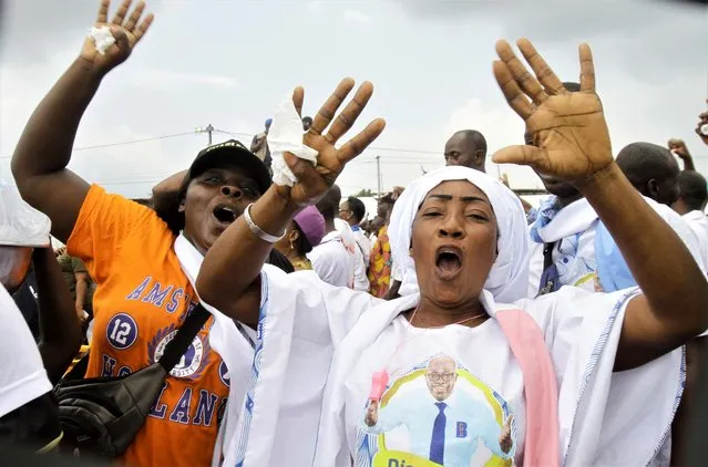 Supporters cheer Ivory Coast's former youth minister Charles Ble Goude upon his return to Abidjan, Ivory Coast, Saturday November 26, 2022, after more than a decade in exile. (Photo by Diomande Bleblonde/AP Photo)