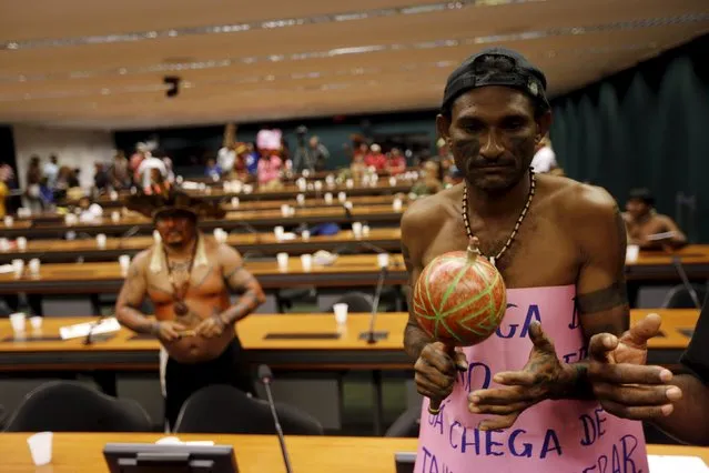 Indigenous leaders from different tribes protest against the violation of their rights as they occupy the Chamber of Deputies in Brasilia, Brazil, October 5, 2015. (Photo by Lunae Parracho/Reuters)