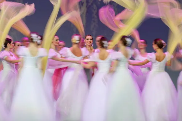 Members of the Beryozka Folk Dance Ensemble founded by Russian choreographer Nadezhda Nadezhdina perform during a concert titled Russian Choreographic Miracle marking the 75th anniversary of the ensemble's founding at the State Kremlin Palace in Moscow on December 12, 2022. Vyacheslav Prokofyev/TASS)