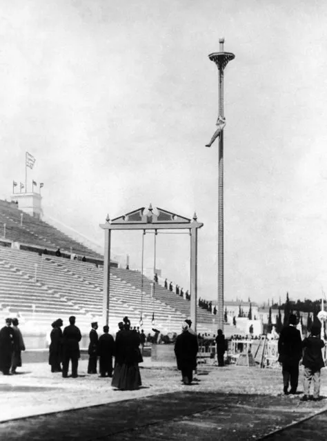 Greek athlete Nikolaos Andriakopoulos on his way to win the gold medal in the rope climbing event  at the first modern International Summer Olympic Games held at the Panathinaiko Stadium on April 10, 1896 in Athens, Greece. (Photo by AP Photo)