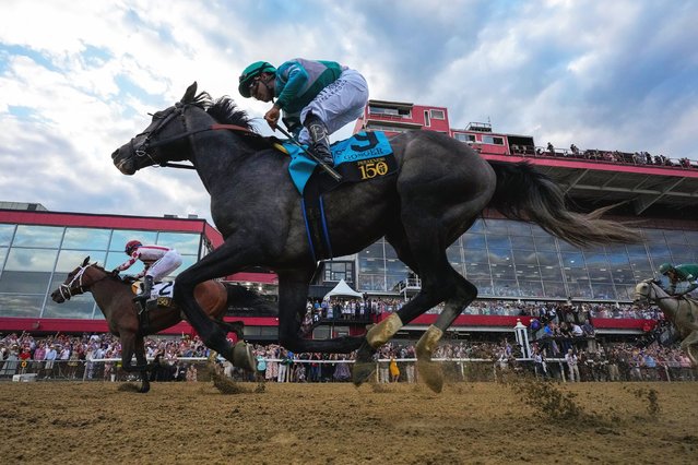 Jockey Umberto Rispoli rides Journalism, left, past Luis Saez and Gosger to win the Preakness Stakes by a half-length on Saturday, May 17, 2025. (Photo by Stephanie Scarbrough/AP Photo)