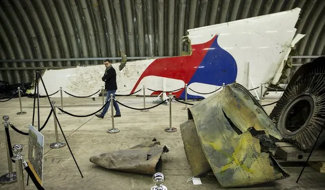 Wreckage of the MH17 airplane is seen after the presentation of the final report into the crash of July 2014 of Malaysia Airlines flight MH17 over Ukraine, in Gilze Rijen, the Netherlands, October 13, 2015. (Photo by Michael Kooren/Reuters)