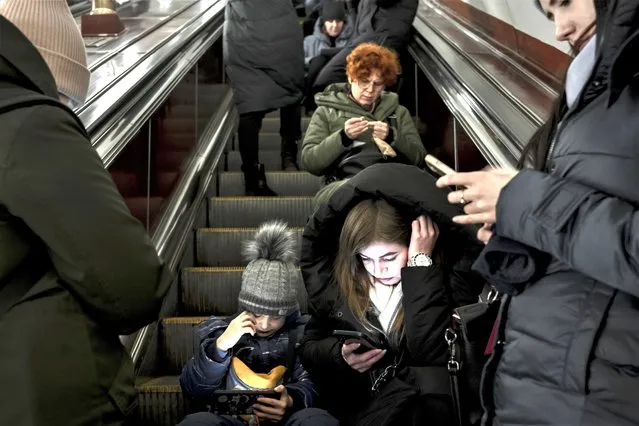 Civilians shelter in a subway station as an air raid alarm sounds in Kyiv, Ukraine, on Friday, February 10, 2023. Russia targeted Ukraine’s already battered infrastructure with drones, rockets and cruise missiles on Friday, raining fire on cities around the country one day after President Volodymyr Zelensky wrapped up a two-day push in Europe for more, faster support from Kyiv’s allies. (Photo by Emile Ducke/The New York Times)
