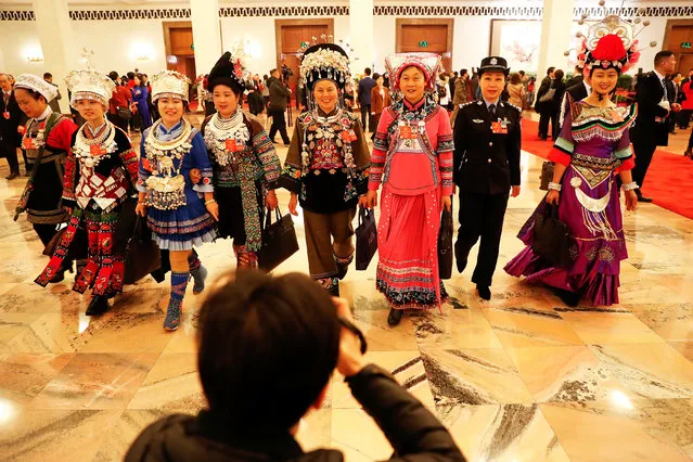 Delegates leave after the opening session of the National People's Congress (NPC) at the Great Hall of the People in Beijing, China on March 5, 2018. (Photo by Damir Sagolj/Reuters)