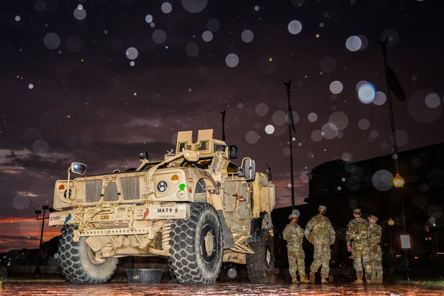 Members of the District of Columbia National Guard stand next to their M-ATV outside Union Station, Sunday, August 17, 2025, in Washington. (Photo by Julia Demaree Nikhinson/AP Photo)