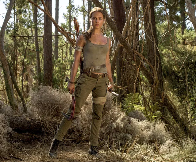 This image released by Warner Bros. Pictures shows Alicia Vikander in a scene from “Tomb Raider”. It took weeks of training and plates full of protein to turn former ballerina Alicia Vikander into action star Lara Croft. (Photo by Graham Bartholomew/Warner Bros. Pictures via AP Photo)