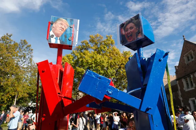 Robots with portraits of U.S. Republican presidential nominee Donald Trump and Democratic presidential nominee Hillary Clinton are seen before the presidential debate at Washington University in St. Louis, Missouri, U.S., October 9, 2016. (Photo by Jim Young/Reuters)