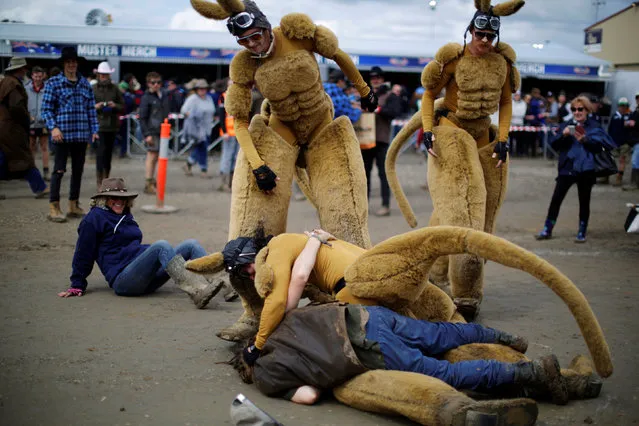 One of several men dressed as a kangaroo is tackled by a drunk man at the Deni Ute Muster in Deniliquin, New South Wales, Australia, September 30, 2016. (Photo by Jason Reed/Reuters)