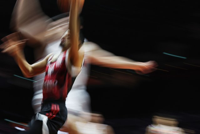 A slow shutter speed photo of Alexey Borges of Flamengo in action during the 2025 FIBA Intercontinental Cup basketball match between Illawarra Hawks and Flamengo at Singapore Indoor Stadium in Singapore, 19 September 2025. (Photo by How Hwee Young/EPA)