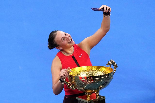 Amanda Anisimova, of the United States takes selfie with the trophy after winning the women's singles final match against Linda Noskova, of the Czech Republic, in the China Open tennis tournament, at the National Tennis Center, in Beijing, Sunday, October 5, 2025. (Photo by Andy Wong/AP Photo)