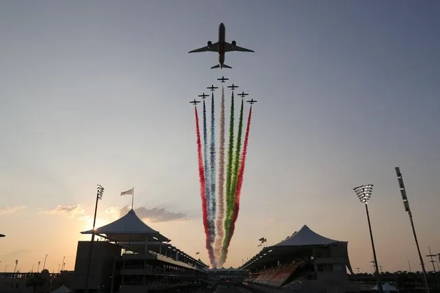 An Etihad jet flies over the circuit ahead of the Abu Dhabi Formula One Grand Prix at the Yas Marina Circuit in the Emirati city of Abu Dhabi on December 13, 2020. (Photo by Kamran Jebreili/Reuters)