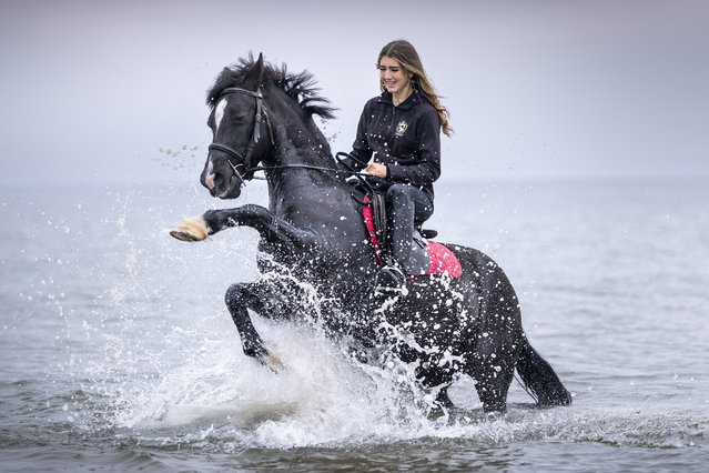 Jess Fulton, 15, from Ayrshire rides her pony Harley through the waves at Irvine Beach, UK on October 20, 2025. (Photo by Jamie Williamson/The Times)