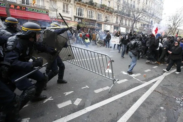 Demonstrators clash with CRS riot policemen near the Place de la Republique after the cancellation of a planned climate march following shootings in the French capital, ahead of the World Climate Change Conference 2015 (COP21), in Paris, France, November 29, 2015. (Photo by Eric Gaillard/Reuters)