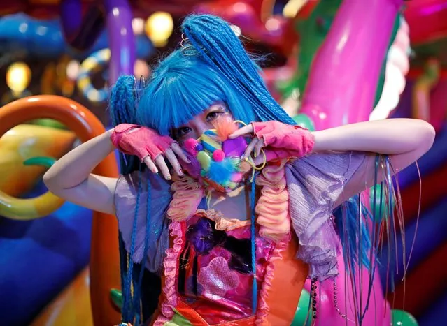 Monster Girl Candy Asachill, an iconic Harajuku girl and a staff member of the cafe, wearing a face mask poses for a photograph at Kawaii Monster Cafe, amid the coronavirus disease (COVID-19) outbreak, in Tokyo,  Japan on January 31, 2021. (Photo by Issei Kato/Reuters)