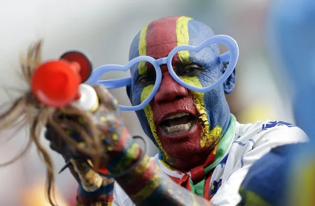 DR Congo’s soccer fan painted in his national colors gestures during the African Cup of Nations Group B soccer match between DR Congo and Zambia in Ebebiyin, Equatorial Guinea, Sunday, January 18, 2015. (Photo by Themba Hadebe/AP Photo)