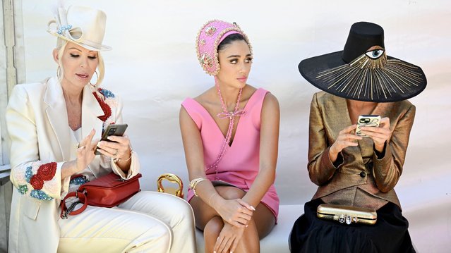 People wait to enter the Fashion on the Field event ahead of the Melbourne Cup horse race at the Flemington Racecourse in Melbourne on November 5, 2024. (Photo by William West/AFP Photo)
