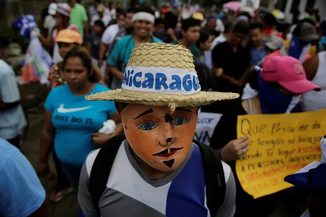 A masked protester takes part in a protest against Nicaraguan President Daniel Ortega's government at Masaya, Nicaragua June 29, 2018. (Photo by Jorge Cabrera/Reuters)