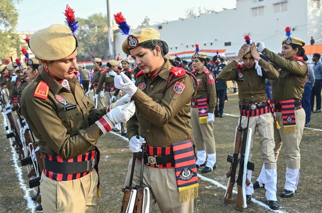 Police personnel prepare before taking part in rehearsals for the country's upcoming Republic Day parade in Amritsar, India on January 24, 2025. (Photo by Narinder Nanu/AFP Photo)