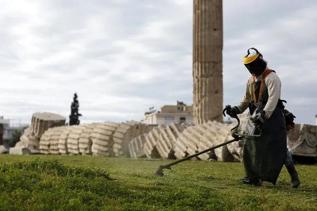 A gardener trims the grass at the Temple of Olympian Zeus in Athens February 4 2015. Greek yields rose on Wednesday as a media report that the ECB was unwilling to approve Athens' proposal to raise the ceiling for its treasury bill issuance cooled optimism that a compromise debt deal may be reached. (Photo by Kostas Tsironis/Reuters)