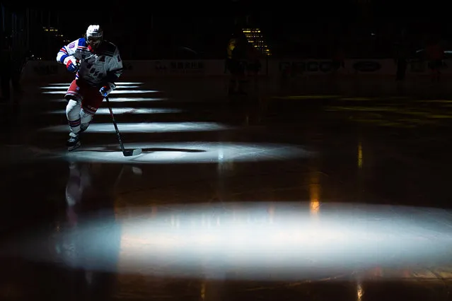 Artemi Panarin #10 of the New York Rangers skates into the spotlight during warmups prior to the start of the game against the Boston Bruins at TD Garden on March 13, 2021 in Boston, Massachusetts. (Photo by Kathryn Riley/Getty Images)